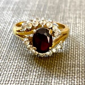 Size 7 ring stamped Thailand Ruby, red prong set stone with white stones ring